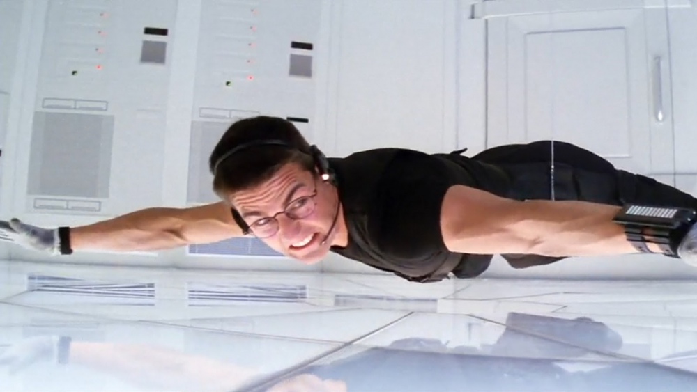 Ethan Hunt suspended by a wire just inches above a pressure sensitive floor.